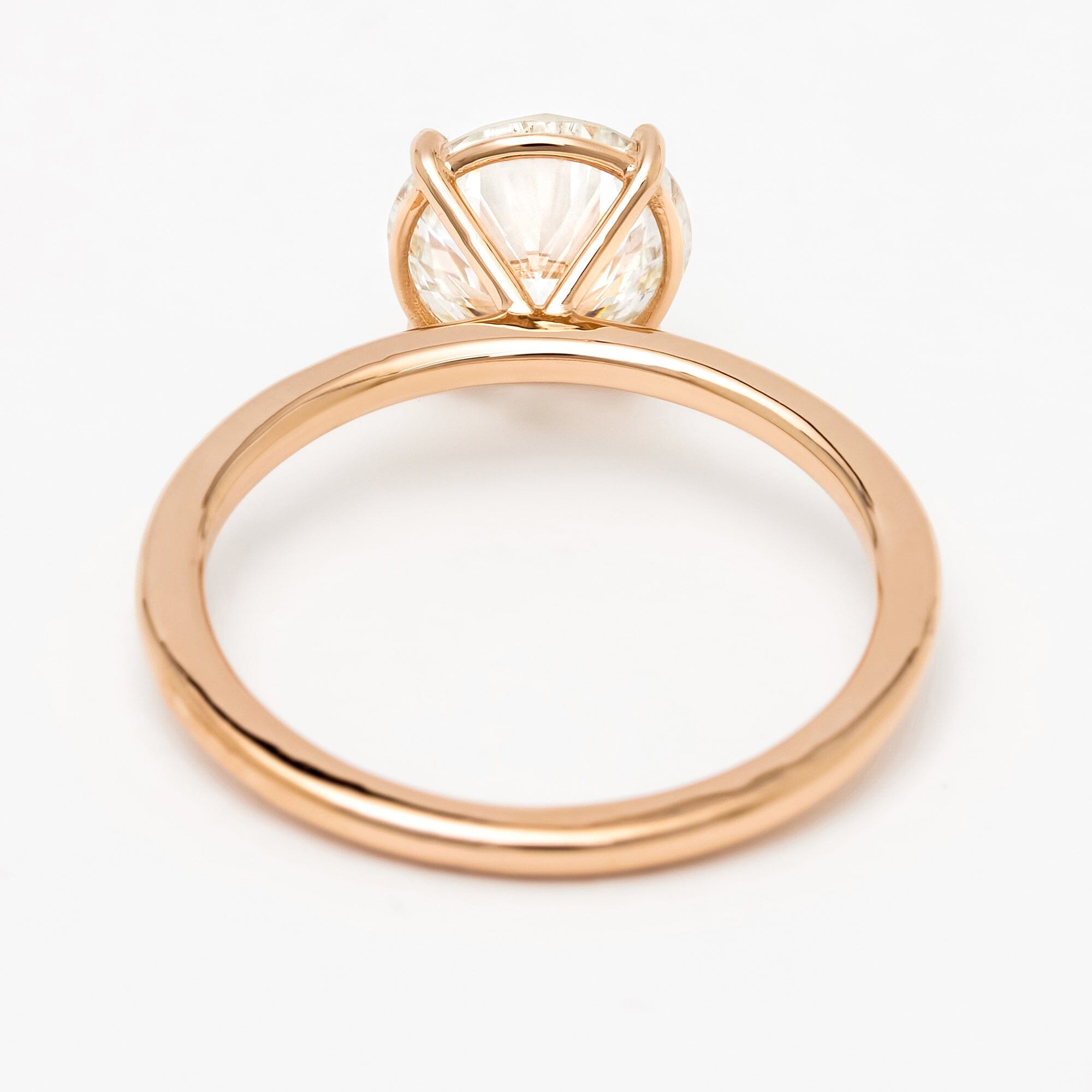 Side profile of rose gold large diamond solitaire ring